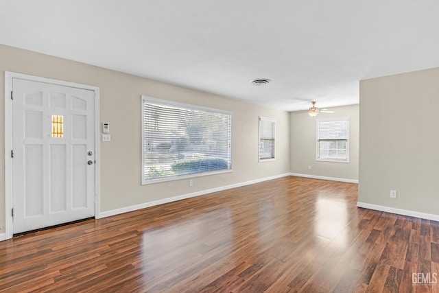 entrance foyer with dark hardwood / wood-style floors and ceiling fan