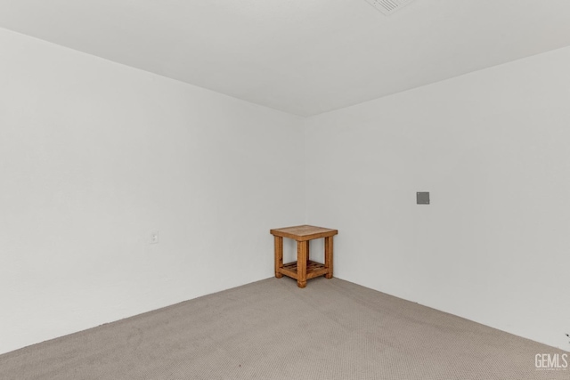 unfurnished room with light carpet