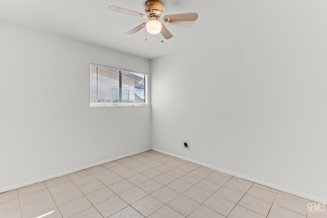 empty room featuring ceiling fan and light tile patterned floors