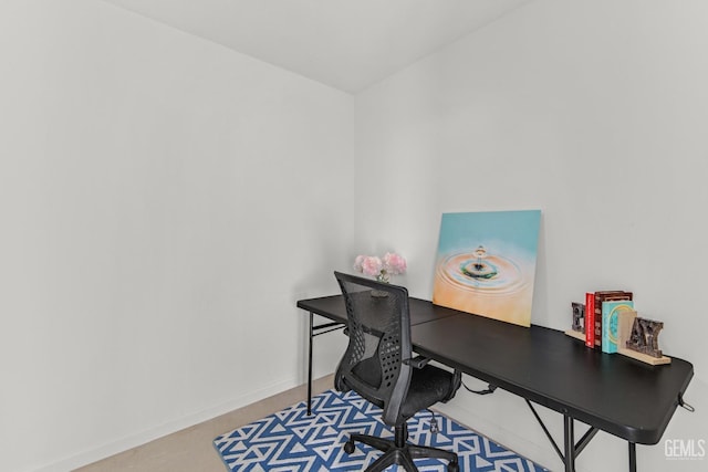 office area featuring concrete floors