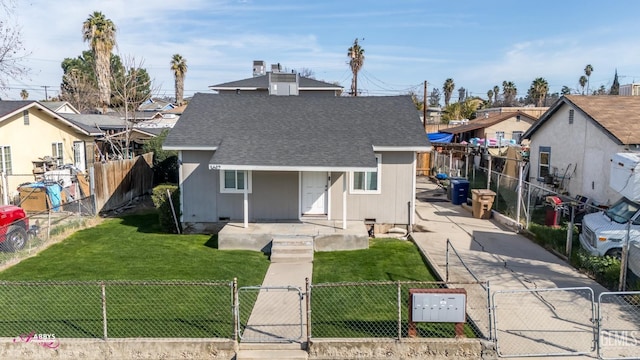 view of front of property with a shingled roof, a fenced front yard, a residential view, and a gate