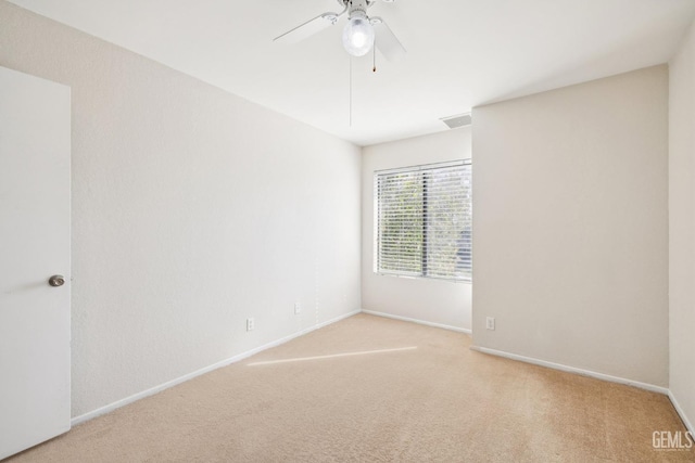 carpeted empty room with ceiling fan