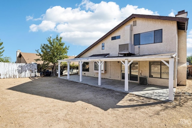 back of house with central AC and a patio