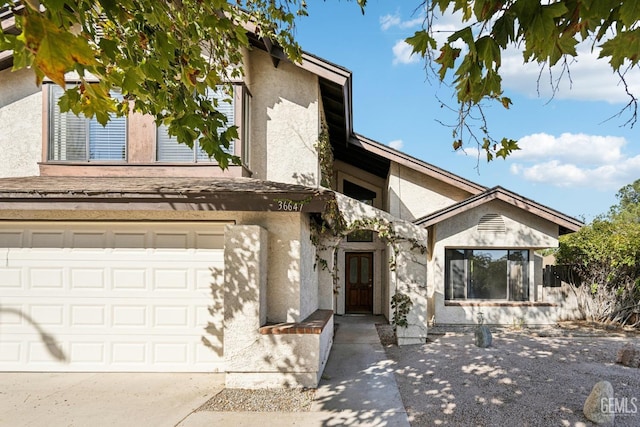 view of front of property with a garage