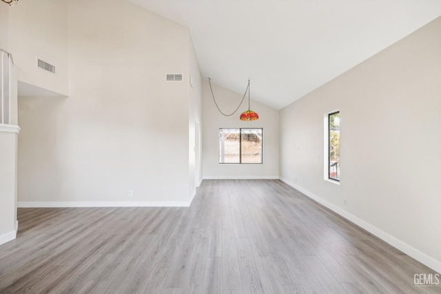 interior space featuring high vaulted ceiling and light wood-type flooring