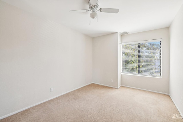 carpeted empty room with ceiling fan