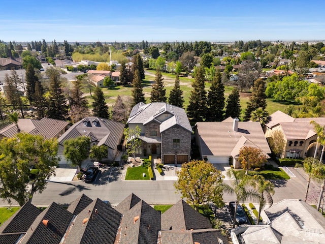 birds eye view of property with a residential view
