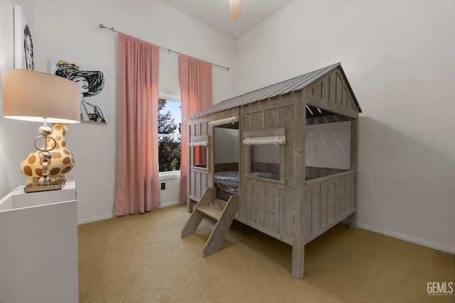 carpeted bedroom featuring baseboards