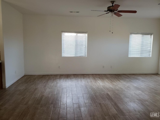 spare room featuring hardwood / wood-style floors and ceiling fan