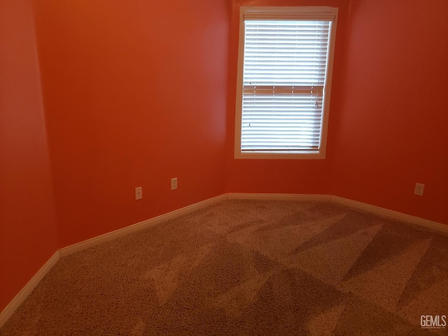 empty room featuring carpet flooring