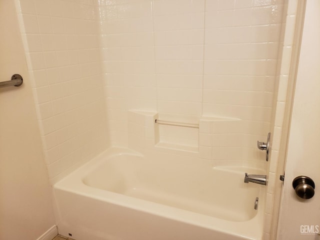 bathroom with bathing tub / shower combination