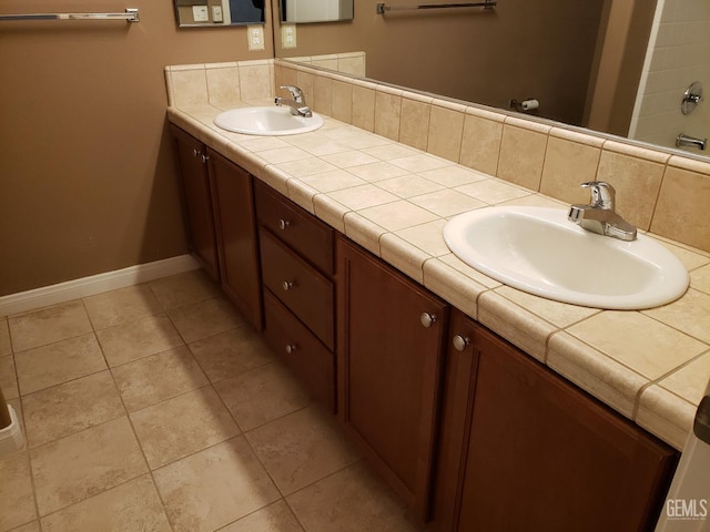 bathroom with tile patterned flooring and vanity