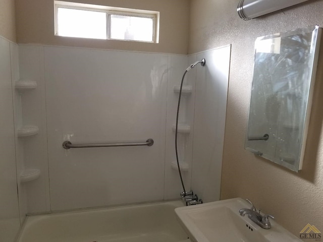 bathroom featuring sink and tub / shower combination