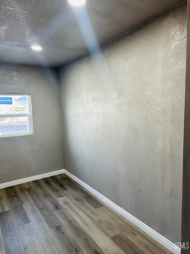 empty room featuring hardwood / wood-style flooring