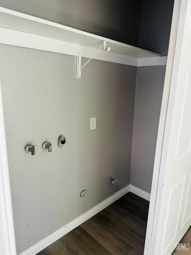 laundry room featuring dark wood-type flooring