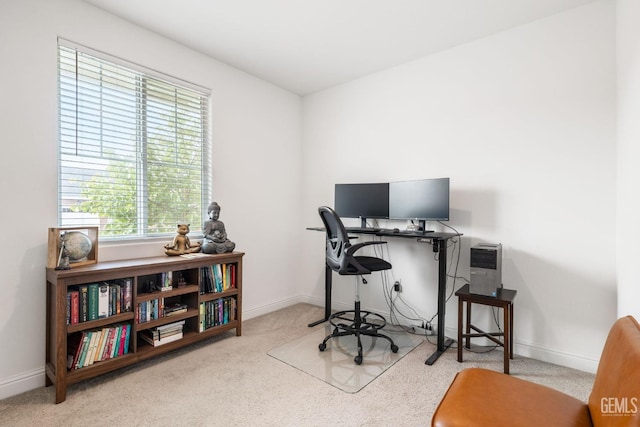 office space with carpet flooring and baseboards