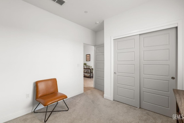 unfurnished room featuring carpet and baseboards