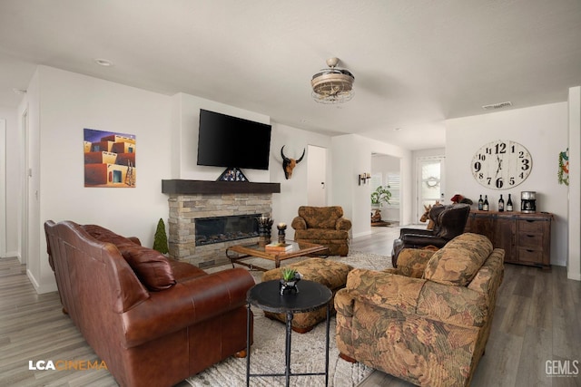 living room with a fireplace and hardwood / wood-style floors