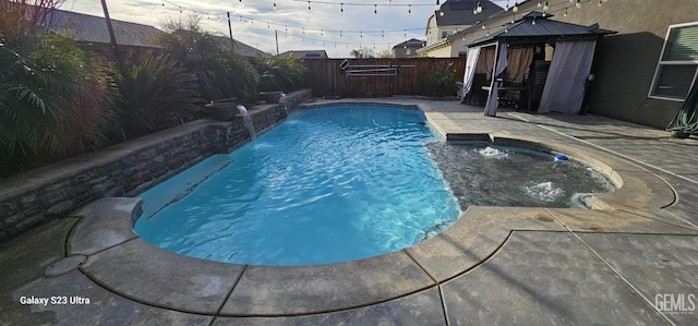 9211 Woodbrook Dr, Shafter, CA 93263 - view of swimming pool featuring a gazebo, a patio area, a fenced in pool, and a fenced backyard