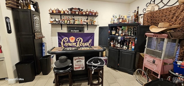 9211 Woodbrook Dr, Shafter, CA 93263 - bar featuring light tile patterned floors and a bar