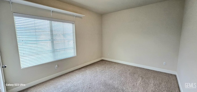 9211 Woodbrook Dr, Shafter, CA 93263 - carpeted spare room featuring baseboards