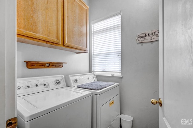 laundry area with cabinet space and independent washer and dryer