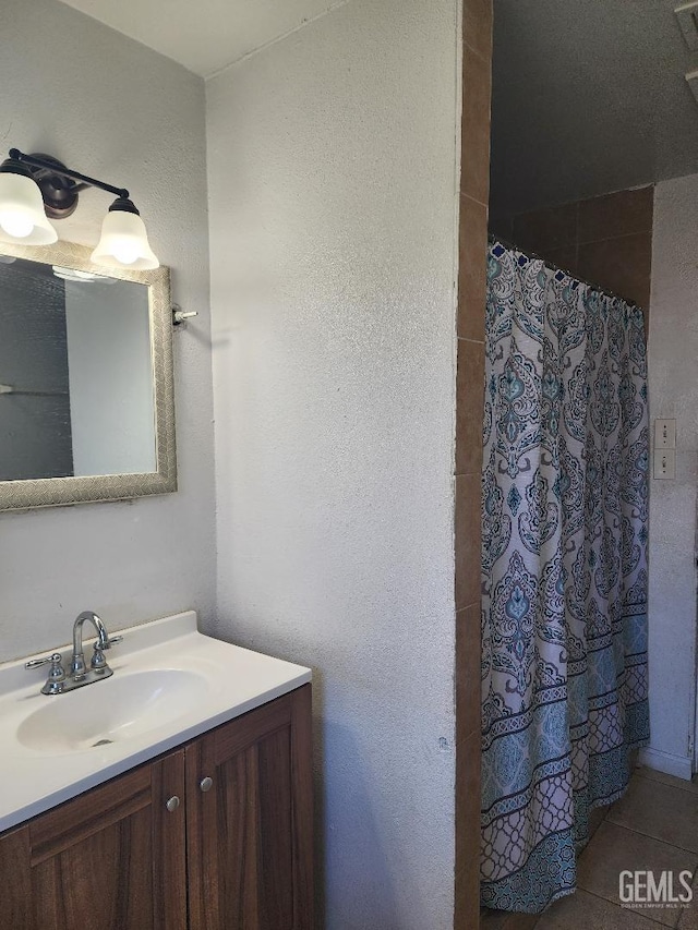 bathroom featuring vanity and a shower with curtain