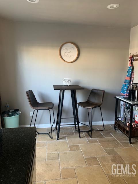 2600 Brookside Dr Unit 46, Bakersfield, CA 93311 - dining space featuring baseboards and stone finish flooring