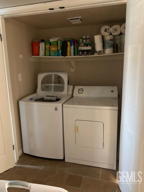 2600 Brookside Dr Unit 46, Bakersfield, CA 93311 - laundry area with washing machine and clothes dryer