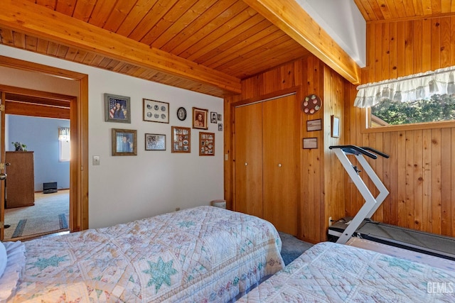 25001 Cannonero Ct, Tehachapi, CA 93561 - bedroom with carpet flooring, wooden walls, a wooden ceiling with exposed beams, and a closet