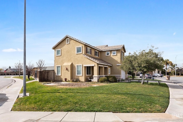 view of side of property with a yard