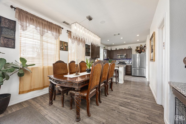 dining space featuring dark hardwood / wood-style floors