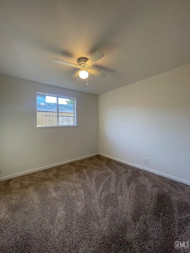 spare room with carpet flooring and ceiling fan