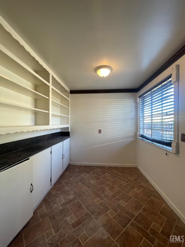 laundry room featuring ornamental molding