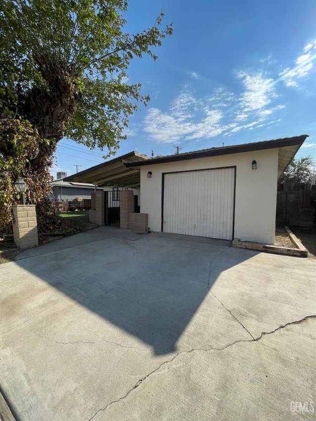 exterior space with a carport