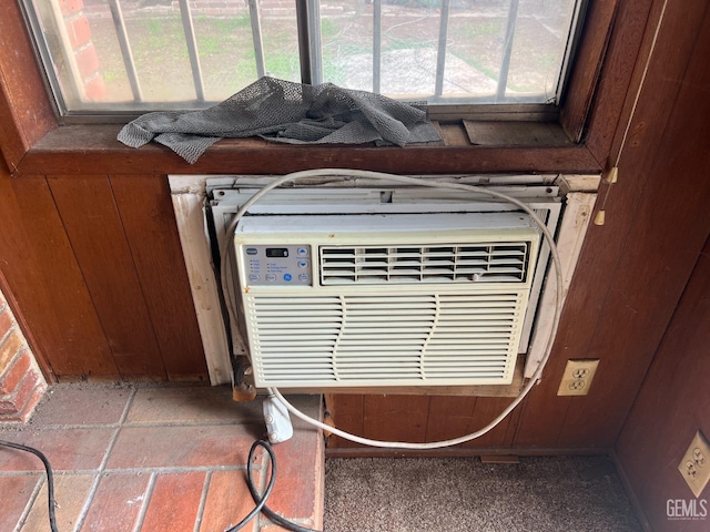 interior details featuring wood walls and a wall mounted air conditioner