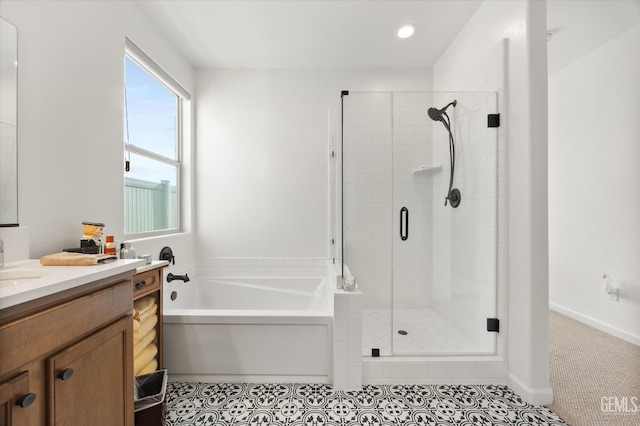 bathroom featuring tile patterned floors, separate shower and tub, and vanity