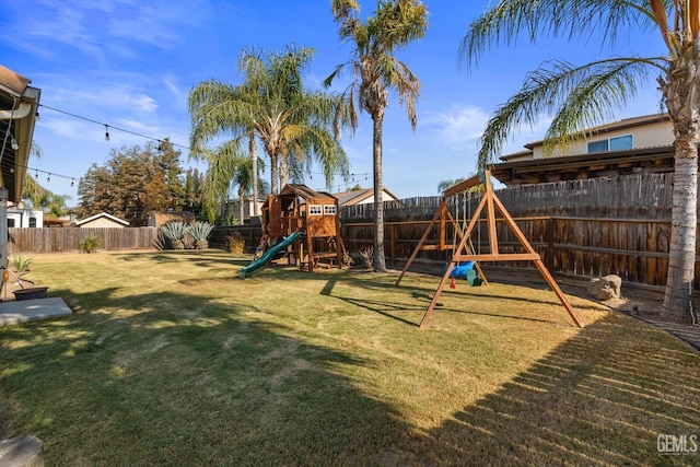 view of play area featuring a yard and a fenced backyard