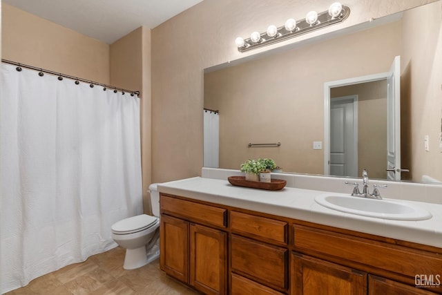 full bathroom featuring vanity and toilet
