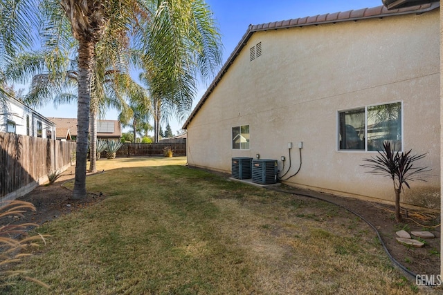 view of yard featuring a fenced backyard and cooling unit