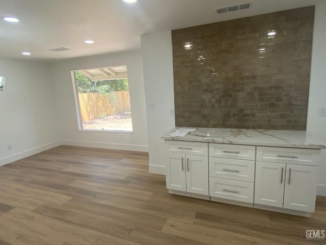 351 Adams St, Wasco, CA 93280 - bar with baseboards, light wood-style floors, and recessed lighting
