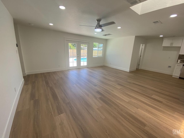 351 Adams St, Wasco, CA 93280 - spare room with a skylight, a ceiling fan, recessed lighting, baseboards, and light wood-style floors