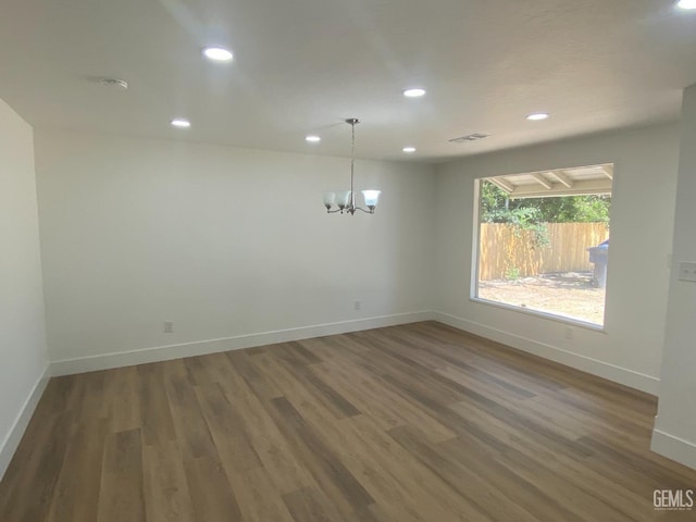 351 Adams St, Wasco, CA 93280 - unfurnished dining area with wood finished floors, baseboards, a chandelier, and recessed lighting