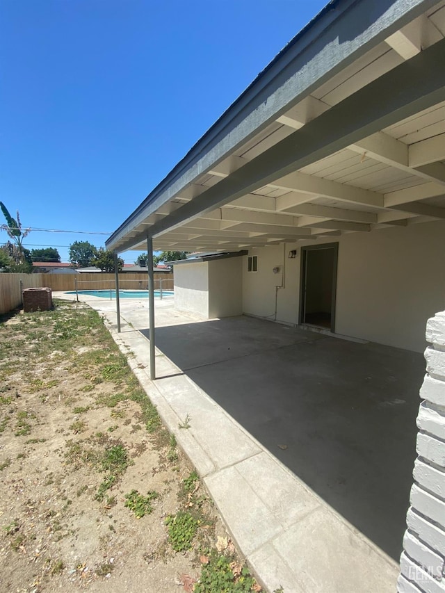 351 Adams St, Wasco, CA 93280 - view of patio featuring fence and an attached carport