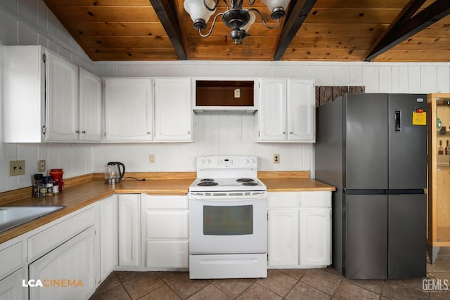 kitchen featuring lofted ceiling with beams, wooden ceiling, freestanding refrigerator, electric range, and white cabinetry