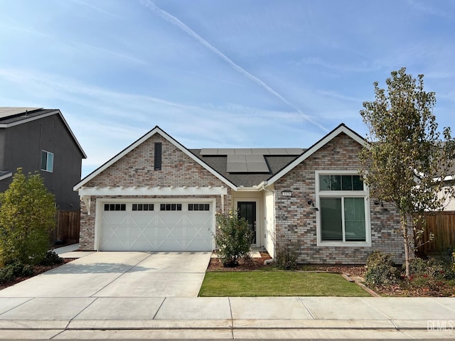 craftsman inspired home featuring a garage, a front yard, and solar panels