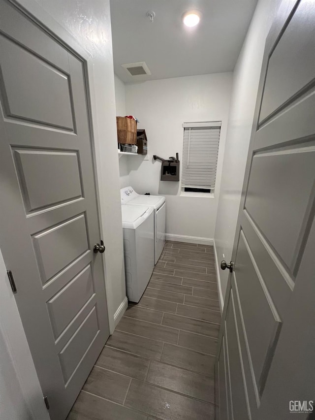 laundry area with washing machine and clothes dryer