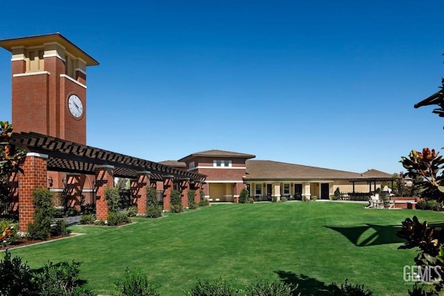 view of property's community with a lawn and a pergola