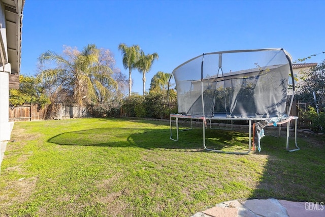 view of yard with a trampoline