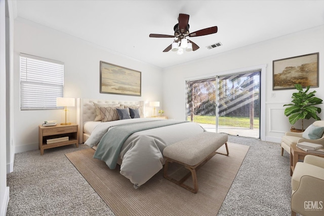 bedroom with ornamental molding, light carpet, access to exterior, and ceiling fan